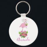 Porte-clés Pink Flamingo in Santa Hat Whimsical Christmas<br><div class="desc">A keychain with a tropical themed Christmas flamingo wearing a pink santa hat. Underneath its feet is a candy cane bouquet with pretty tropical flowers and pink berries. A sprig of holly on its chest.</div>