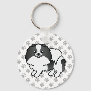Porte-clés Pomeranian à couleur parti noir et pattes de dessi