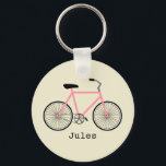 Porte-clés Porte - clé à vélo rose<br><div class="desc">Un porte - clé avec l'illustration d'une bicyclette rose. Personnalisez avec votre nom sous vélo.</div>