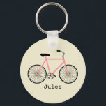 Porte-clés Porte - clé à vélo rose<br><div class="desc">Un porte - clé avec l'illustration d'une bicyclette rose. Personnalisez avec votre nom sous vélo.</div>