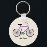 Porte-clés Porte - clé de vélos pourpre<br><div class="desc">Un porte - clé avec l'illustration d'un vélo violet. Personnalisez avec votre nom sous vélo.</div>