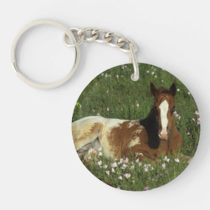 Porte-clés Poulain d'Appaloosa fixant en fleurs