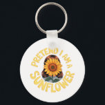 Porte-clés Prétendre que je suis un tournesol mignon et drôle<br><div class="desc">Description : Fleur en style avec cette adorable chemise costume "Pretend I Am a Sunflower" ! Idéal pour les amateurs de tournesol et de nature, ce tee-shirt mignon et drôle apporte des vibes ensoleillées à Halloween ou toute journée décontractée. Une tenue parfaite pour les amoureux de les jardins, les amateurs...</div>
