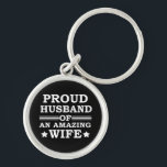 Porte-clés proud husband of an amazing wife<br><div class="desc">This original proud husband of an amazing wife graphic design with awesome typography font lettering is a great birthday and Fathers day gift idea for all appreciated, special, brave, wonderful, and one-of-a-kind fathers, husbands, and dads! The best amazing and funny holiday present for your awesome dad.This design is also fitting...</div>