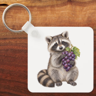 Porte-clés Raton laveur tenant des raisins violets