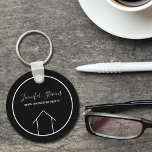Porte-clés Real Estate Modern Black White Custom House<br><div class="desc">This modern realtor keychain is custom made with your realty company name under the the agent name in chic typography. This minimalist black and white key chain feature a simple line drawing of a house. Contemporary gift for an agent working to help you buy a home.</div>