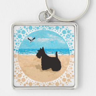 Porte-clés Scottie à la plage avec mouette