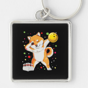Porte-clés Shiba joue au bowling Chien drôle avec un cadeau