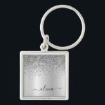 Porte-clés Silver Glitter Glam<br><div class="desc">Argent Faux Foil Parties scintillant à étincelles métalliques brossé Monogramme Nom Clés (Porte - clé). Cela rend le cadeau parfait pour 16 ans, mariage, douche nuptiale, anniversaire, baby shower ou bachelorette pour quelqu'un qui aime le luxe glam et les styles chic.</div>