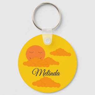 Porte-clés Soleil orange dans un ciel doré :