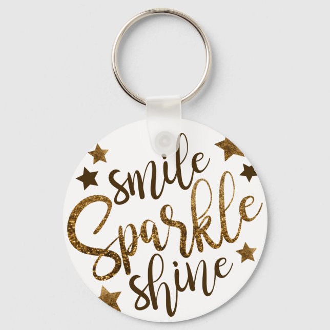 PORTE-CLÉS SOURIRE ÉCLAIRAGE, ÉTOILE PARTIES SCINTILLANT EN O (Recto)