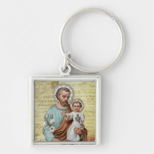 Porte-clés St Joseph avec le cru religieux de Jésus de béb
