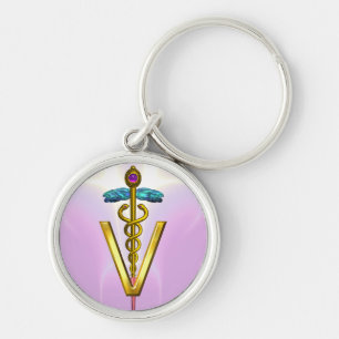 Porte-clés SYMBOLE VÉTÉRINAIRE CADUCE D'OR Rose Blanc