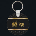 Porte-clés Trendy cute luxury  black /golden elephant in love<br><div class="desc">Trendy cute luxury  black /golden elephant in love design. Sophisticated and artistic color composition. A modern,  unique graphic work of art made for you. You can customize this product by adding your own name  nickname or monogram. Perfect gifts for elephant and unique designs  lovers,   a gift for every occasion.</div>