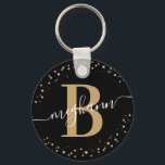 Porte-clés Trendy Girly Black Gold Nom Script Monogrammé<br><div class="desc">Fille, élégant, tendance, moderne, noir et or, monogramme de nom initial script personnalisé monogrammed porte - clé. Doté d'une initiale monogramme et d'un script de nom de girly dans une police de caractères de calligraphie lettrée et d'un cadre de cercle pointillé autour de votre monogramme. Un cadeau féminin parfait pour...</div>