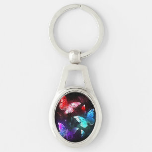 Porte-clés Trois papillons brillants sur l'arrière - plan de