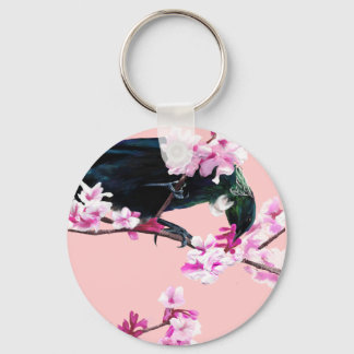 Porte-clés Tui Bird dans les fleurs de cerisiers