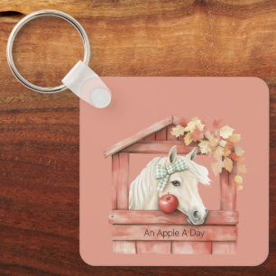 Porte-clés Un cheval blanc une pomme par jour