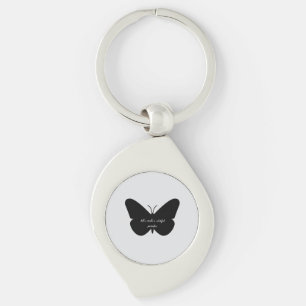 Porte-clés Une citation simple dans un simple papillon