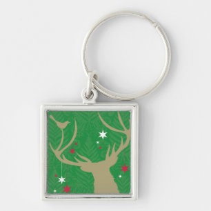 Porte-clés Une silhouette d'un cerf commun avec des étoiles