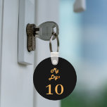 Porte-clés Unité de location de logo personnalisé en or noir<br><div class="desc">Ajoutez votre propre logo d'entreprise et un numéro. Arrière - plan de couleur noire.</div>