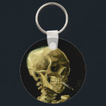 Porte-clés Van Gogh Fumer du squelette<br><div class="desc">Porte - clé représentant la peinture à l’huile de Vincent van Gogh,  Skull of a Skeleton with Burning Cigarette (1885-86). Un grand cadeau pour les amateurs de post-impressionnisme et d'art hollandais !</div>
