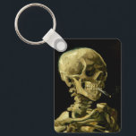 Porte-clés Van Gogh Fumer du squelette<br><div class="desc">Porte - clé représentant la peinture à l’huile de Vincent van Gogh,  Skull of a Skeleton with Burning Cigarette (1885-86). Un grand cadeau pour les amateurs de post-impressionnisme et d'art hollandais !</div>