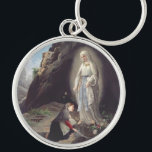 Porte-clés Vierge Marie de Lourdes<br><div class="desc">Elle est vénérée sous ce titre par l'église catholique romaine en raison de ses apparitions qui se sont produites à Lourdes, en France. Première apparition du 11 février 1858, dont Bernadette Soubirous.</div>