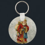 Porte-clés Vintage Style Father Christmas Santa Claus<br><div class="desc">A vintage image of the classic Father Christmas wearing his famous red coat and carrying a bag full of toys. This old-fashioned Santa Claus also known as old Saint Nicholas is slim and holds a walking stick for travelling throughout the land gifting toys to all the girls and boys. The...</div>