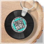 Porte-clés Vinyle | DJ musicien | Code QR<br><div class="desc">Voici notre porte - clé de style vinyle personnalisable QR Code - l'accessoire parfait pour le professionnel de la musique! Ce porte - clé présente un disque vinyle élégant en bleu et gris aqua, ainsi qu'un code QR qui peut être lié à votre propre musique. Avec notre fonction "personnalisez", vous...</div>