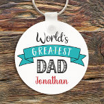 Porte-clés World’s Greatest Dad Modern Typography Turquoise<br><div class="desc">“World’s Greatest Dad.” Let Dad know what you really think of him. Cool, modern black, red, and white typography and an aqua blue banner overlay a white background. Customize with his name for the perfect, personalized keepsake keychain he’ll use every day. This keychain comes in small and large sizes, as...</div>