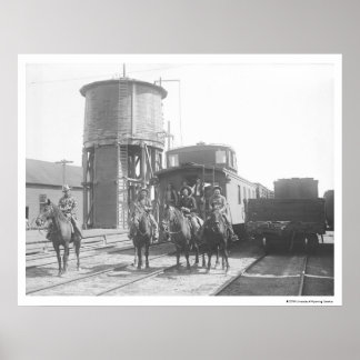 Poster Cowboys à cheval posant devant un train
