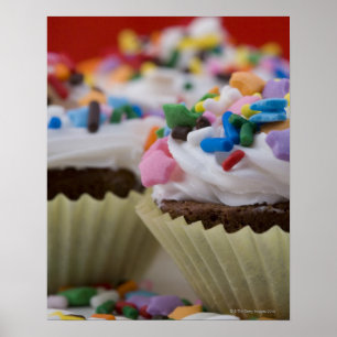 Poster Les cupcakes au chocolat avec glaçage et arroses,