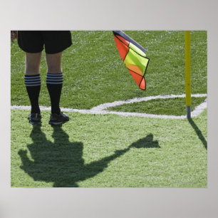 Poster Soccer referee holding flag.