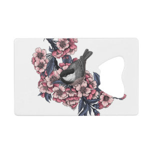 Poulet sur une branche de cerise en fleurs