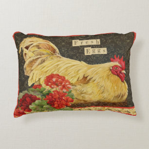 Poulets/poules nichant avec des géraniums coussin
