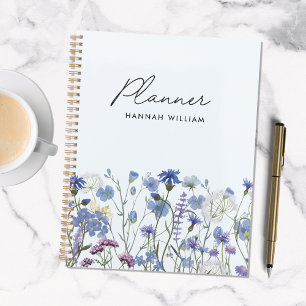 Pré fleuri de fleurs sauvages à l'aquarelle bleue 
