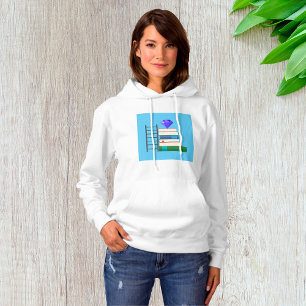 Pull À Capuche Gemme violette sur pile de livres avec échelle