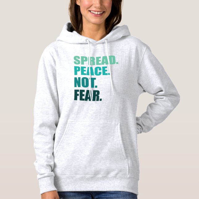 Pull À Capuche Propager la paix sans craindre le texte vert (Devant)