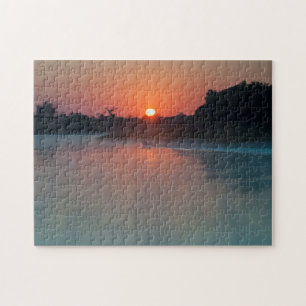 Puzzle Bateau au lever du soleil sur la rivière