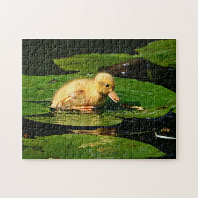 Puzzle Canard de bébé jaune flottant sur des coussinets d (Horizontal)