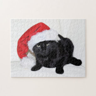 Puzzle Chat noir mignon avec le casquette de Père Noël