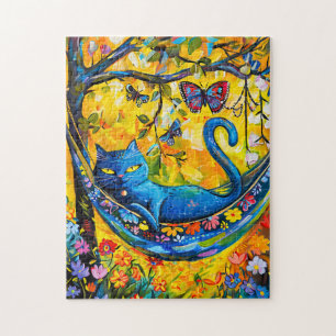 Puzzle Chat peint dans un hamac sous un arbre avec papill
