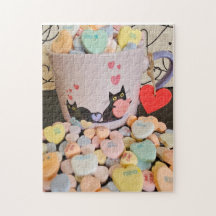 Cœurs en bonbons avec énigme de chats
