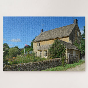 Puzzle Cottage anglais avec le jardin et le drapeau