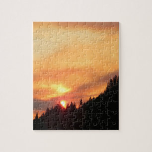 Puzzle Coucher de soleil sur les montagnes...