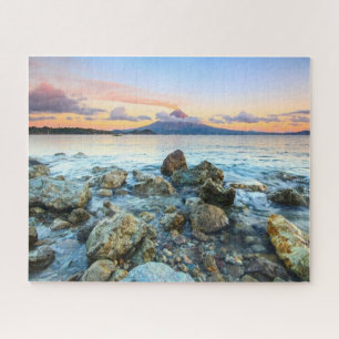 Puzzle Coucher de soleil sur l'océan avec des vagues douc