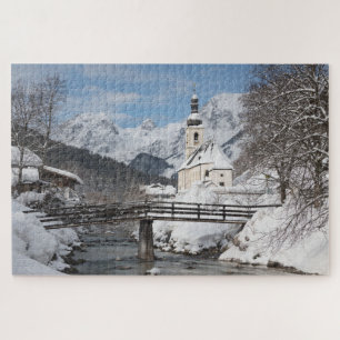 Puzzle Église dans la neige avec les Alpes en hiver