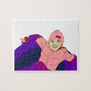 Puzzle Fille faisant du tubing dans la neige