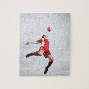 Puzzle Footballeur et ballon de football dans l'entre le